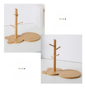 Detail of bamboo storage rack with cat-shaped base and tree-style branches for keys
