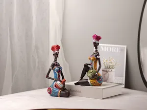 Close-up of resin African woman figurines in colorful tribal dress for home decor