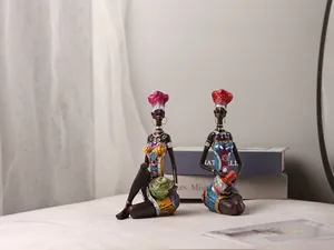 Exotic African woman resin figurines with colorful attire for elegant home decor accent