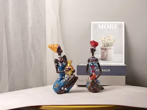 Detail of African female resin figurines with hand-painted ethnic jewelry and attire