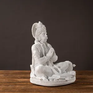 Hanuman resin statue in meditative pose with intricate white crown and ornate details