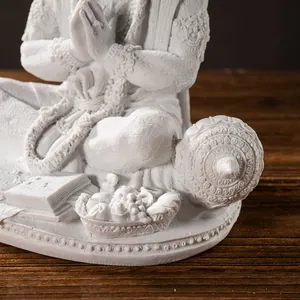 Detailed close-up of Hanuman resin statue showing intricate carvings and white matte finish