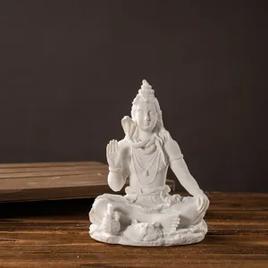 Macro detail of white Shiva statue with matte finish and divine snake around the neck