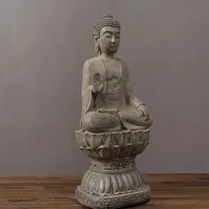 Detailed view of Buddha statue with faux stone texture and multi-layer lotus base