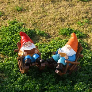 Relaxing garden gnome statues reading books on rocking chairs, outdoor resin decor set