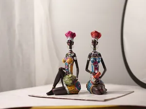 Detailed resin African figurines with colorful rhinestones and ethnic art style