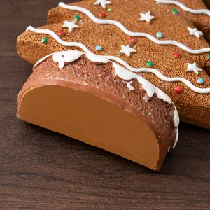 Macro shot of gingerbread Christmas tree resin ornament with foam texture and colorful dots