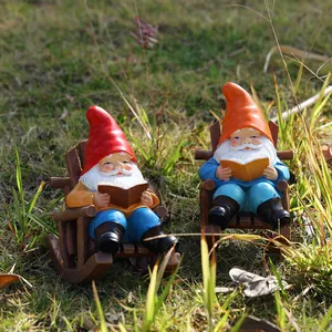 Garden gnomes reading books on rocking chairs, handcrafted resin dwarf statues set