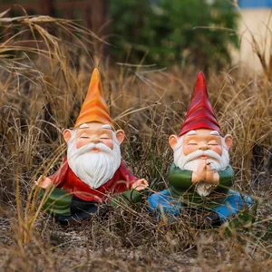 Set of two resin garden gnomes in meditation pose for outdoor decorative use