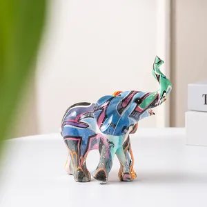 Close-up of modern graffiti elephant resin statue with colorful artistic spray painting