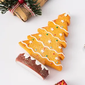 Detailed macro view of gingerbread Christmas tree resin ornament with festive sugar details
