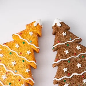Detailed view of gingerbread Christmas tree resin crafts with star and snow decorations