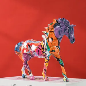 Detail of colorful graffiti horse sculpture featuring vibrant paint and high-gloss resin