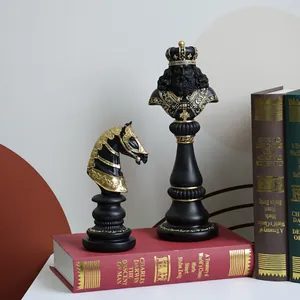 Detailed view of resin chess pieces King and Knight in matte black and gold finishes