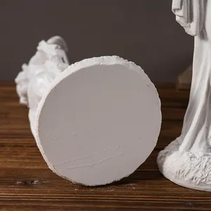 Macro shot of the round textured resin base and detailed craftsmanship of a Hindu deity statue
