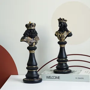 Elegant black and gold resin chess king and queen statue decor on desk