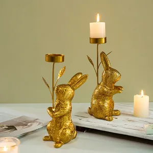 Pair of golden bunny resin candle holders with leaf texture for home decor