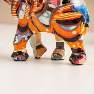 Close-up of vibrant graffiti pattern and sturdy legs of the elephant resin statue
