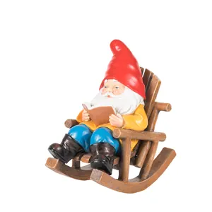 Gnome garden statue sitting on rocking chair reading a book, resin lawn ornament decor