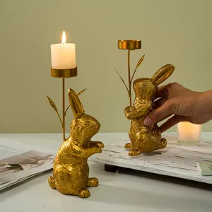 Golden rabbit candle holder with embossed leaf texture and vintage finish for home decor