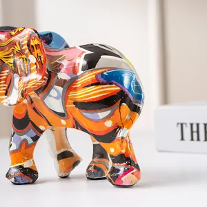Detailed view of modern graffiti elephant statue with vibrant abstract resin patterns