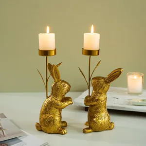 Detailed view of golden rabbit candle holder featuring embossed leaf texture and metallic finish