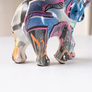 Close-up of colorful graffiti elephant ornament with abstract patterns and modern resin finish