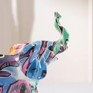 Macro detail of graffiti art elephant resin ornament showing colorful street art patterns