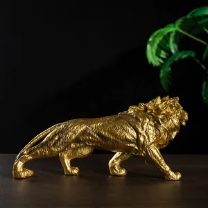 Majestic golden lion statue in resin for modern luxury home office desktop decor