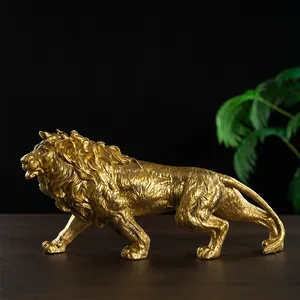 Elegant gold lion statue ornament in a walking pose for home and office luxury decor