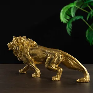 Detailed view of a golden lion statue with intricate carving and metallic texture