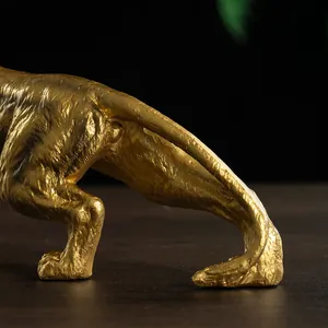 Close-up of golden leopard statue showing granular texture and detailed craftsmanship