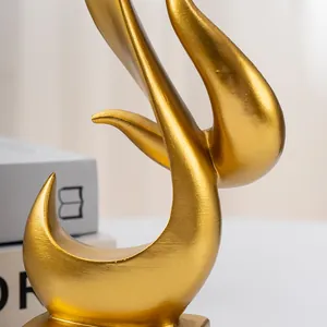 Macro shot of modern golden resin sculpture with brushed metal texture and flame design