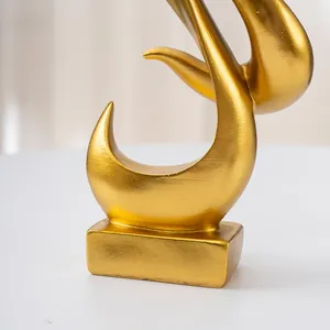 Macro view of golden flame abstract resin sculpture with brushed metal texture detail