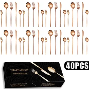 Macro detail of 40-piece rose gold stainless steel cutlery set with elegant gift box