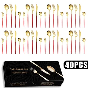 Detailed close-up of 40-piece red and gold stainless steel cutlery set with black gift box
