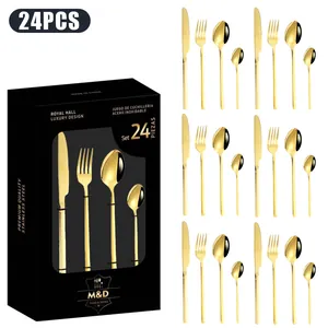 Détail macro du service de couverts 24 pièces en acier inoxydable doré avec coffret