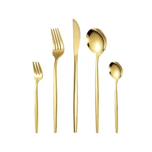 5-piece gold stainless steel cutlery set with modern streamlined handles on white background