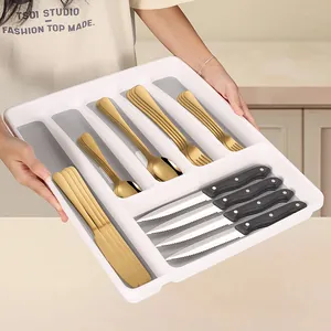 5-compartment drawer organizer with gold stainless steel cutlery set and black steak knives