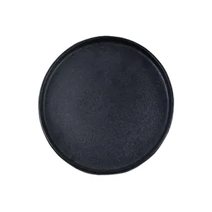 Japanese style black matte ceramic round steak plate with minimalist non-slip surface