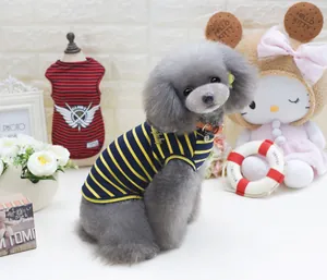 Detailed close-up of blue and yellow striped cotton dog vest with orange collar detail