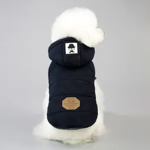 Detail of dark blue quilted dog vest with mustache patch and faux leather tag