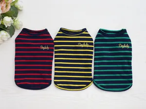 Three striped cotton pet vests in red, yellow, and green with golden embroidery