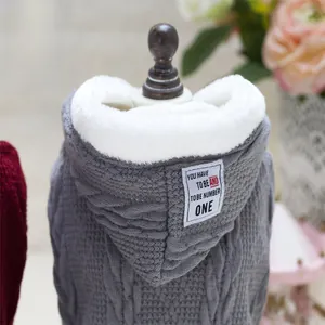 Close-up of grey pet hoodie with thick knit texture and soft white faux fur lining