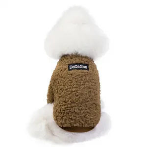 Close-up of brown sherpa fleece pet vest with soft texture and ribbed hem detail