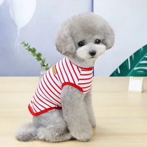 Macro shot of breathable red and white striped cotton pet shirt with leather logo patch