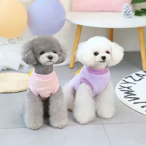 Cozy velvet pet vests in pink and purple with cute flower detail for small dogs