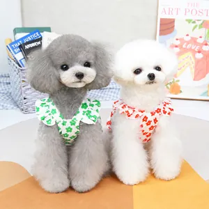 Floral pet dresses with ruffle collars for cats and dogs in green and red daisy patterns