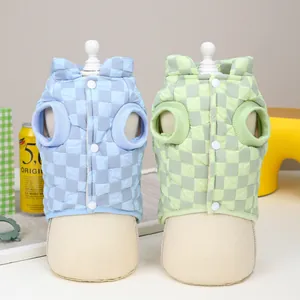 Quilted checkerboard pet vests in light blue and green with snap buttons for cats and dogs