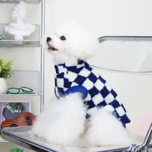 Blue and white checkerboard knit pet sweater for dogs on a white dog